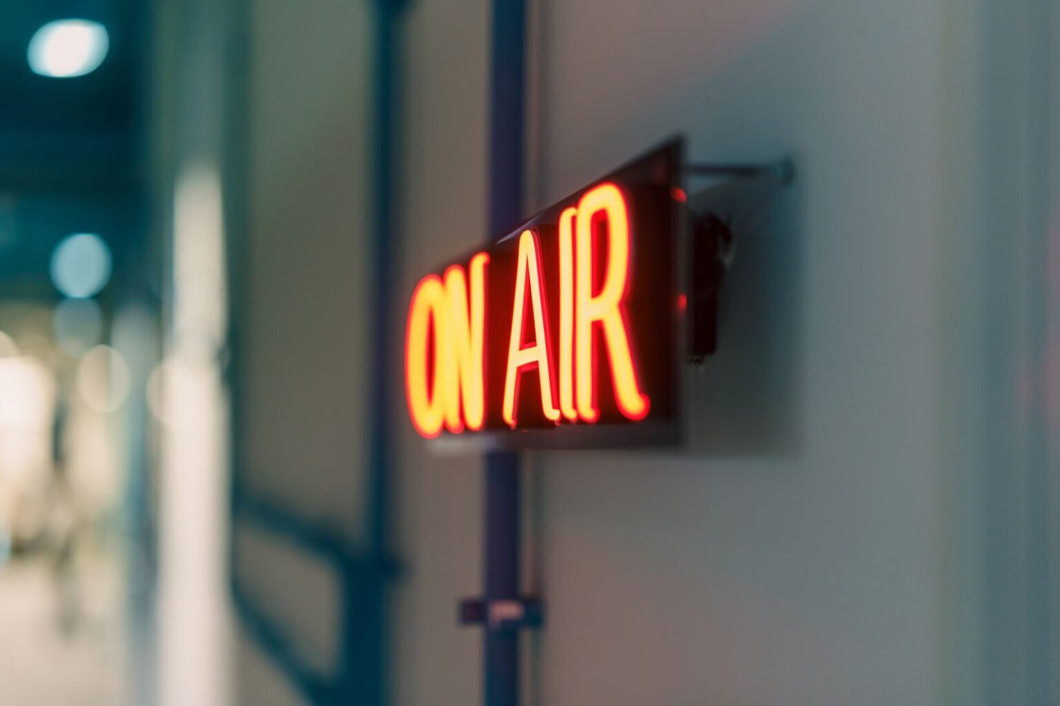 Neon On Air sign glowing in a radio studio